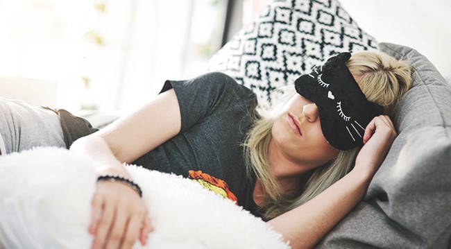 Woman asleep with eyemask Woman asleep with eyemask