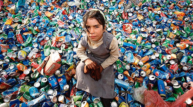 girl collecting waste cans