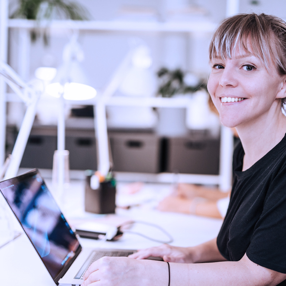 Aspiring female director working with laptop