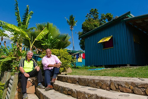 Fijian Village with Peter Drysdale and Eroni Puamau sat on the steps