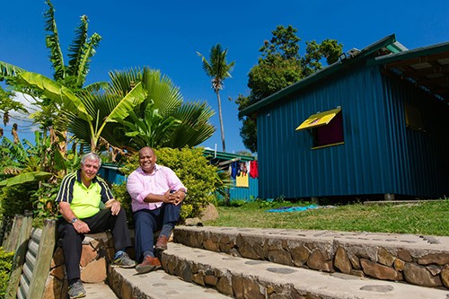 Fijian Village with Peter Drysdale and Eroni Puamau sat on the steps Fijian Village with Peter Drysdale and Eroni Puamau sat on the steps