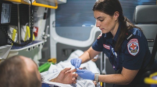 paramedic treating patient