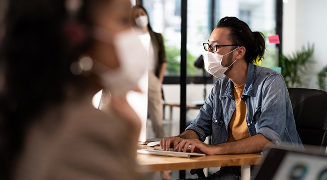 Man wearing mask in coffee shop