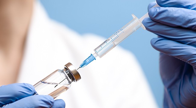 Needle in vaccine vial