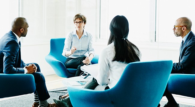 Meeting on blue chairs