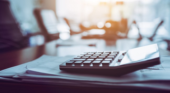 Calculator on Documents on Table Calculator on Documents on empty Table