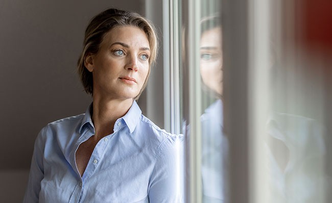Work, Health and Safety Woman looking out of window