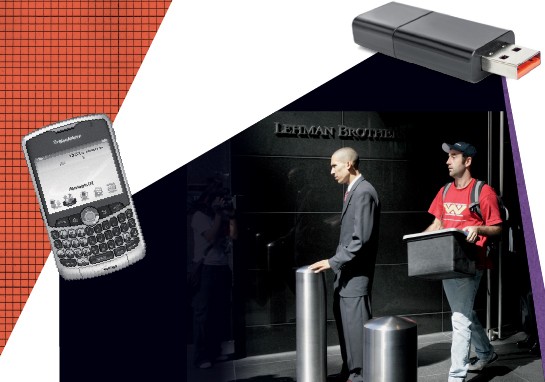 Blackberry and USB drive and two man standing infront of building, one holding a box.