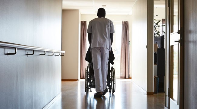 carer pushing wheelchair